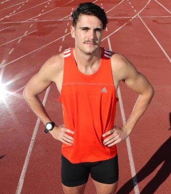 Portrait of Australian sprinter Tom Gamble on a running track